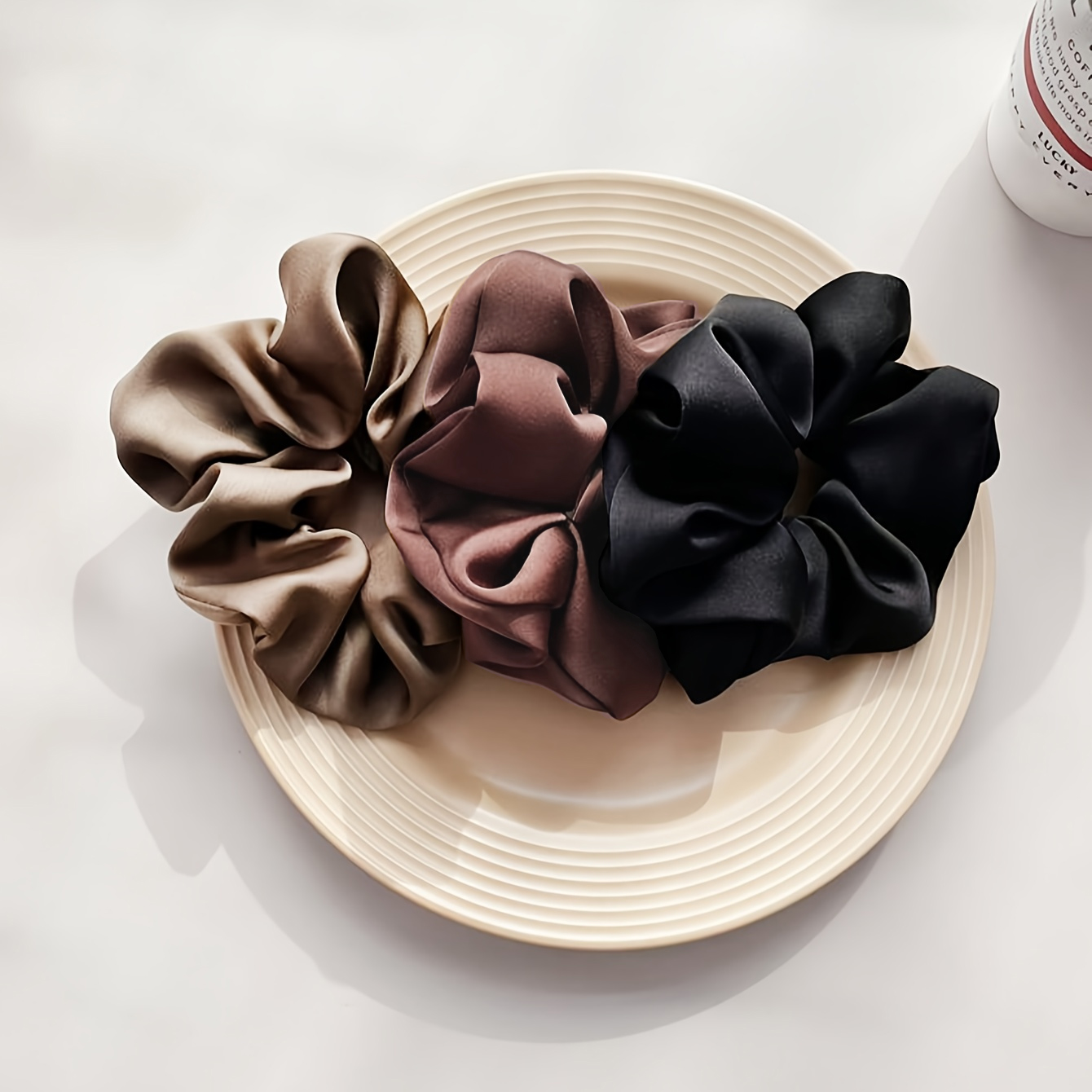 A set of three monochrome sati - Hair Care Gift Set review and price
